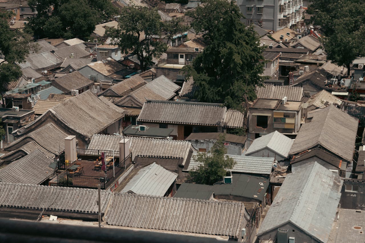 Explore a serene aerial view showcasing traditional Asian rooftops in an urban setting.